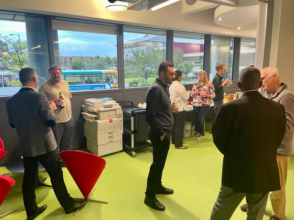 Guests chatting with drinks at Electric Works before the SmartSheffield #19 talks